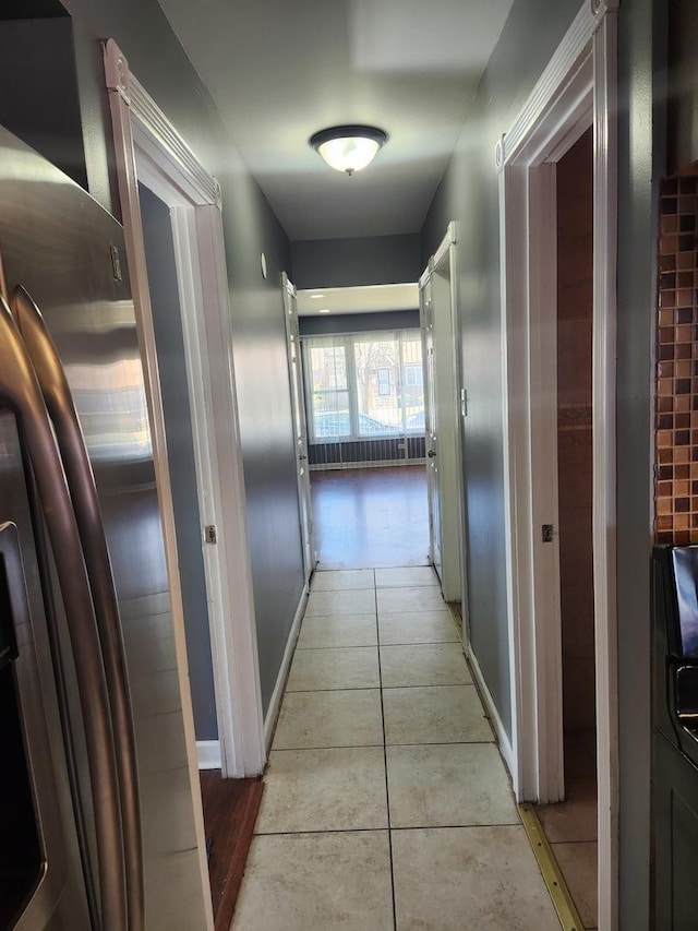 hallway with light tile patterned floors