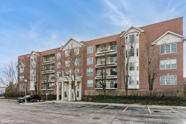 view of property featuring uncovered parking