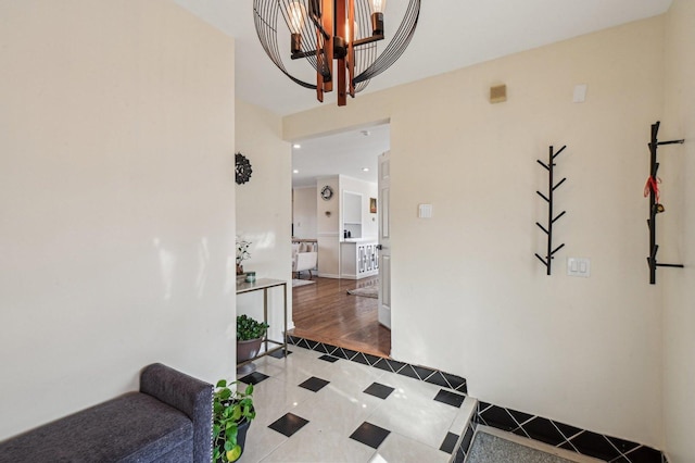 hall with tile patterned floors and baseboards