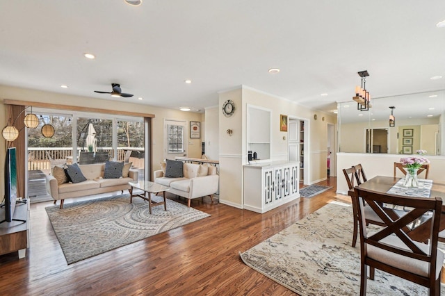 living area featuring recessed lighting, wood finished floors, and a ceiling fan