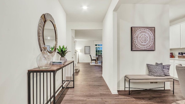 hall with hardwood / wood-style flooring