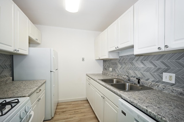 kitchen featuring sink and white cabinets