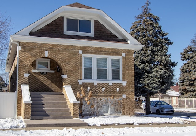 view of front of property featuring brick siding