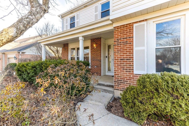 entrance to property with brick siding