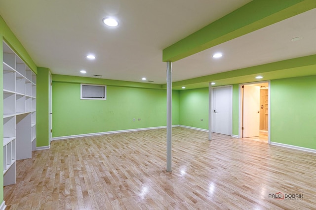 finished basement with baseboards, wood finished floors, and recessed lighting