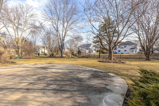 view of road with driveway and a residential view