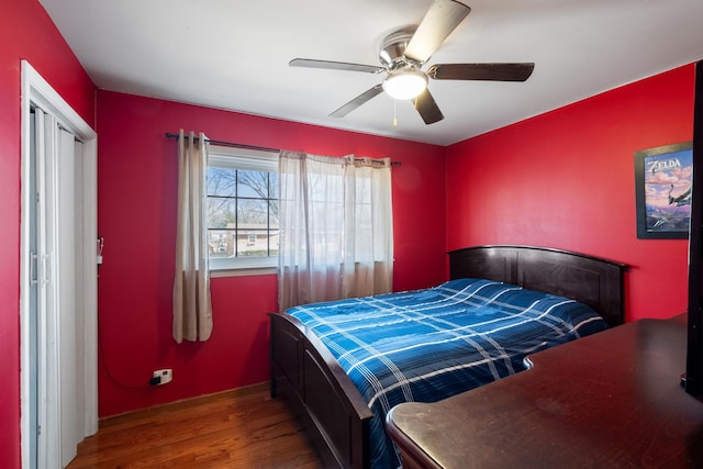 bedroom with ceiling fan and hardwood / wood-style floors