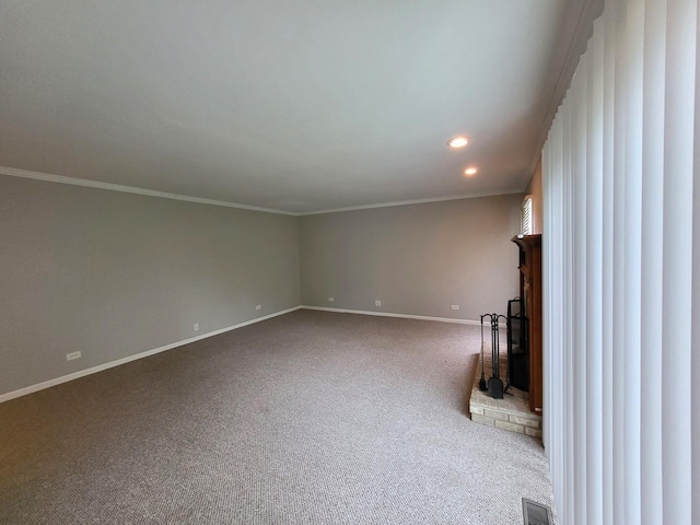 unfurnished living room featuring crown molding and carpet flooring