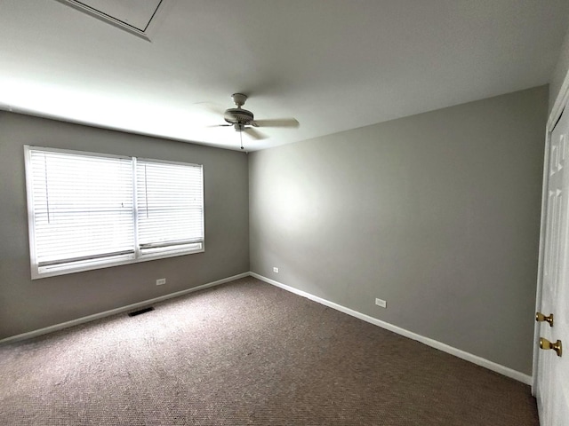 empty room featuring carpet floors and ceiling fan