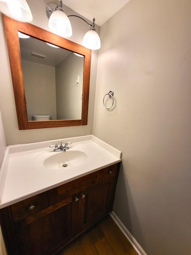 bathroom with vanity and toilet