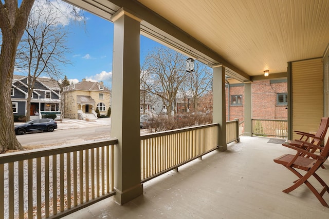 balcony with a residential view and a porch