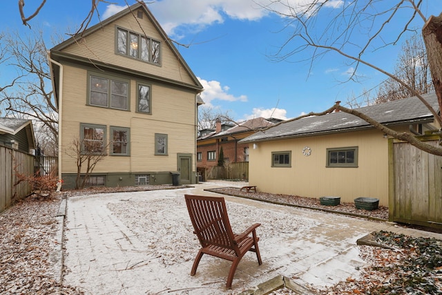 back of house featuring a patio area and fence