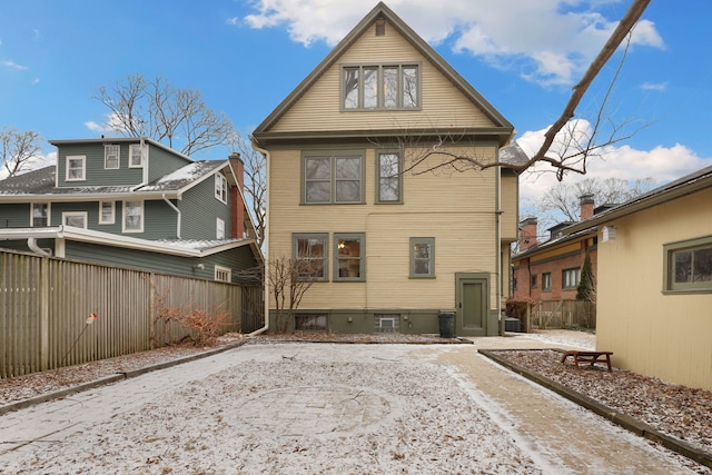 rear view of property with fence