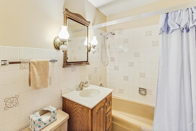 full bath featuring toilet, tile walls, shower / bath combination with curtain, and vanity