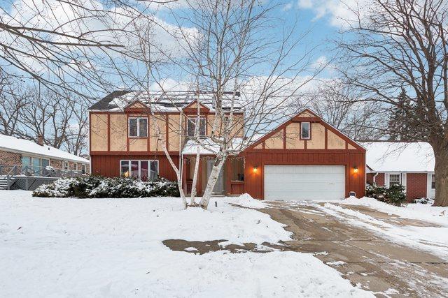 tudor home featuring a garage