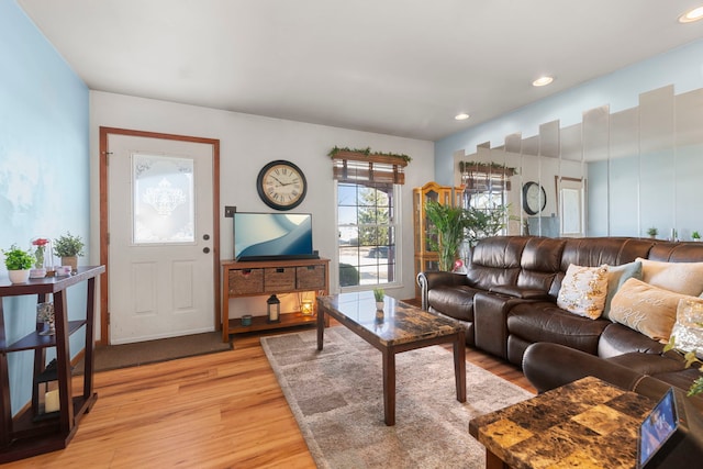 living room with recessed lighting and light wood-style floors