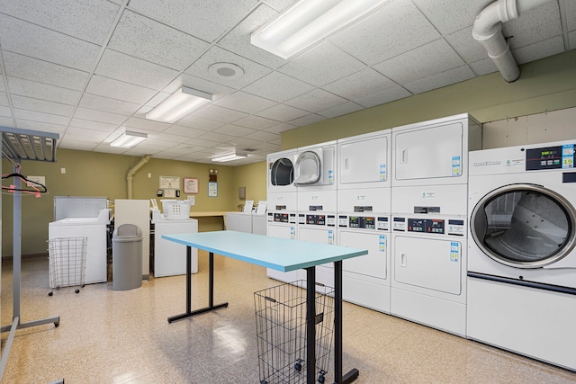 washroom featuring washer and dryer and stacked washer / drying machine