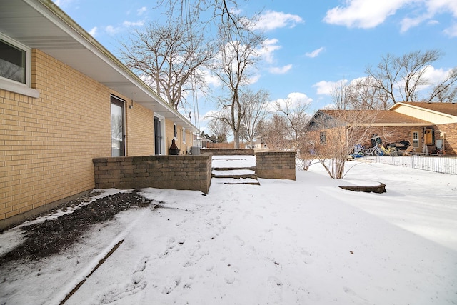 view of yard covered in snow