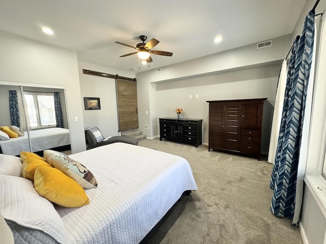 614 E Baltimore St, Wilmington, IL 60481 - bedroom with a ceiling fan, visible vents, a barn door, light carpet, and recessed lighting