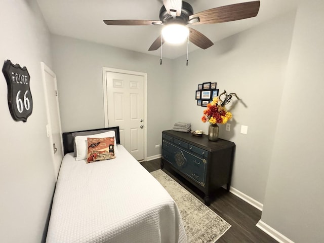614 E Baltimore St, Wilmington, IL 60481 - bedroom with baseboards, dark wood-style floors, and a ceiling fan