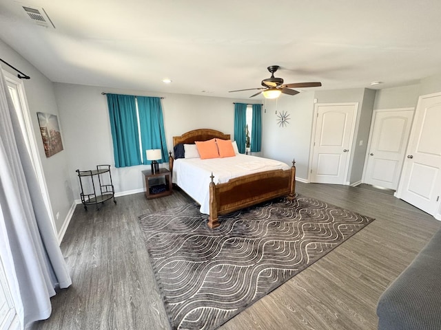 614 E Baltimore St, Wilmington, IL 60481 - bedroom featuring wood finished floors, visible vents, recessed lighting, ceiling fan, and baseboards