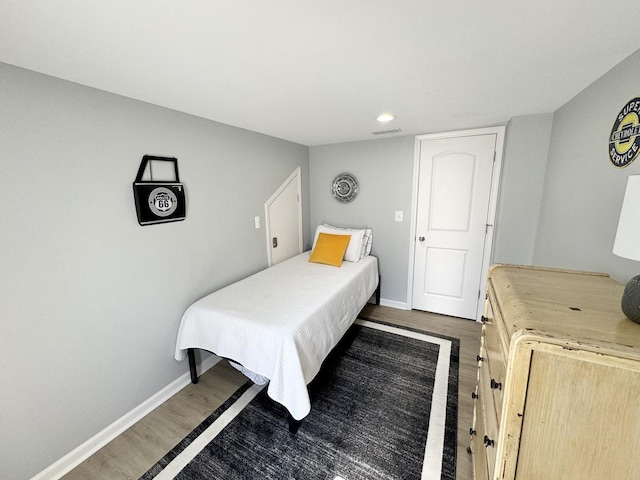 614 E Baltimore St, Wilmington, IL 60481 - bedroom with visible vents, dark wood-style flooring, baseboards, and recessed lighting