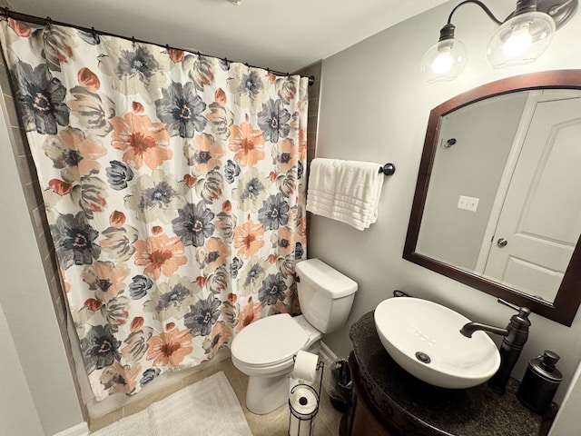 614 E Baltimore St, Wilmington, IL 60481 - bathroom with vanity, toilet, tile patterned flooring, and a shower with curtain