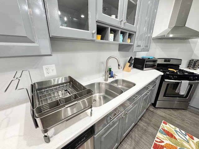 614 E Baltimore St, Wilmington, IL 60481 - kitchen with a sink, wall chimney exhaust hood, light countertops, and appliances with stainless steel finishes