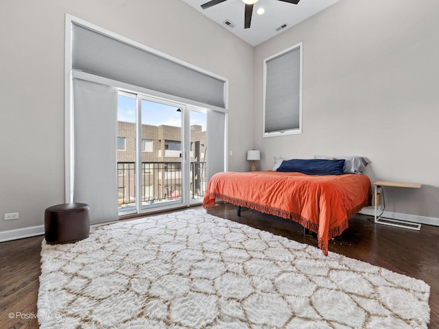 bedroom featuring ceiling fan, dark wood-type flooring, and access to outside