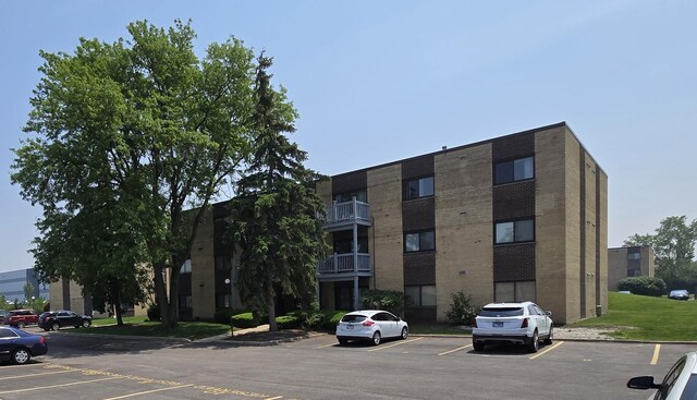 15 Piper Ln Unit 102, Prospect Heights, IL 60070 - snow covered building featuring a view of apartment building / complex