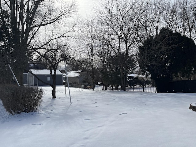 view of yard layered in snow