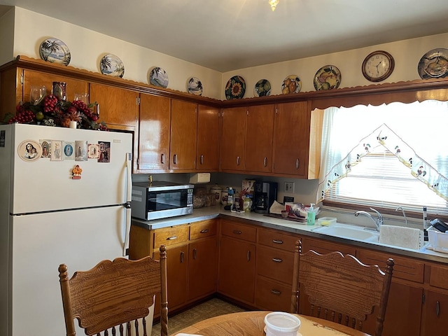 kitchen featuring sink and white refrigerator