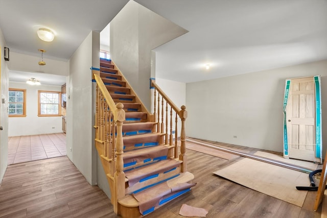 staircase with wood finished floors