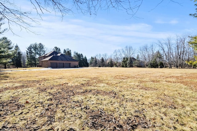 view of yard with a rural view