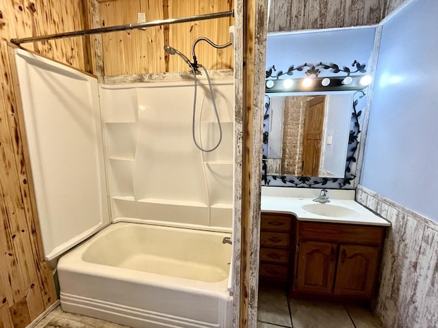 full bath with vanity, bathtub / shower combination, and wainscoting