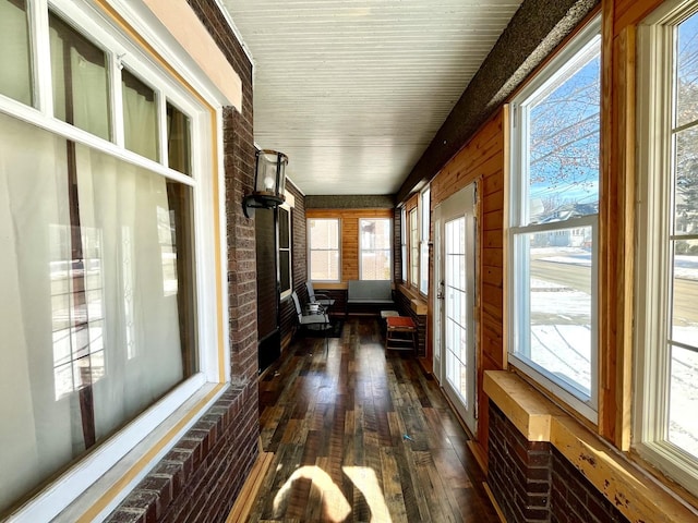 unfurnished sunroom with plenty of natural light