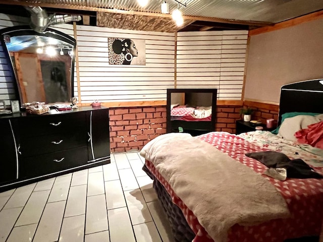 bedroom featuring wooden ceiling and wood walls