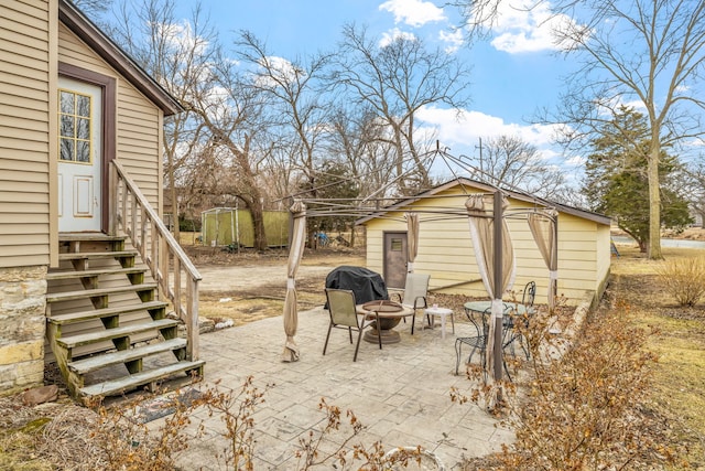 exterior space featuring an outbuilding, area for grilling, and entry steps