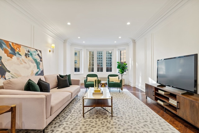 living room featuring dark hardwood / wood-style flooring and crown molding