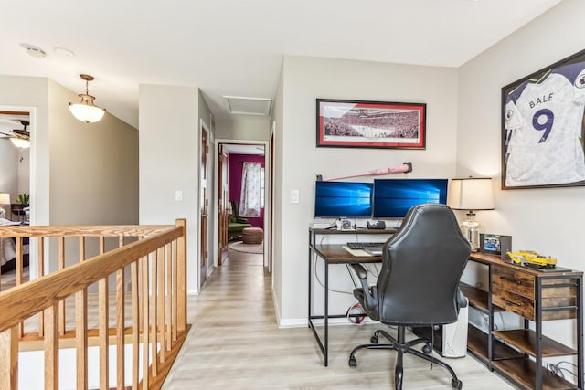 office with attic access, light wood-type flooring, and baseboards