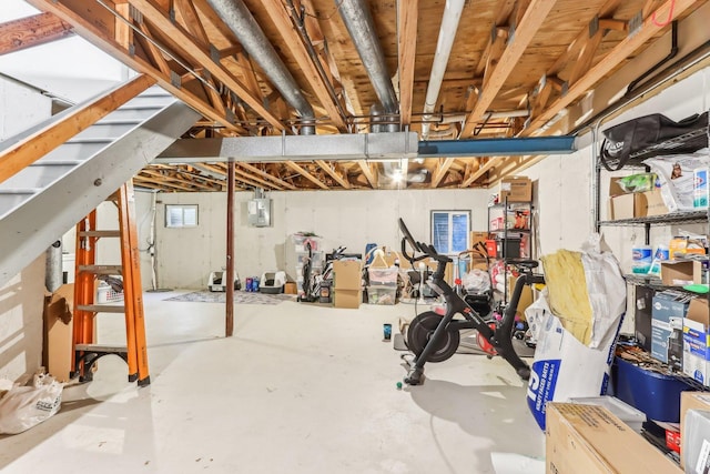 unfinished basement featuring electric panel