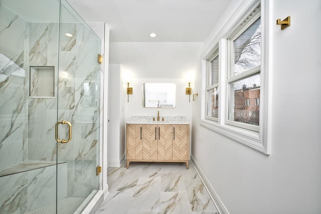 full bath featuring a marble finish shower, baseboards, recessed lighting, marble finish floor, and vanity