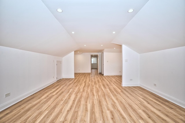 bonus room with light wood finished floors, recessed lighting, baseboards, and vaulted ceiling