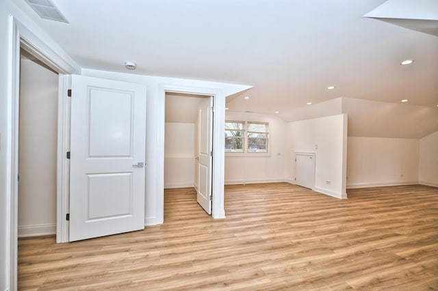 bonus room featuring visible vents, baseboards, lofted ceiling, recessed lighting, and light wood-style flooring