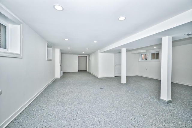 finished basement featuring recessed lighting and baseboards