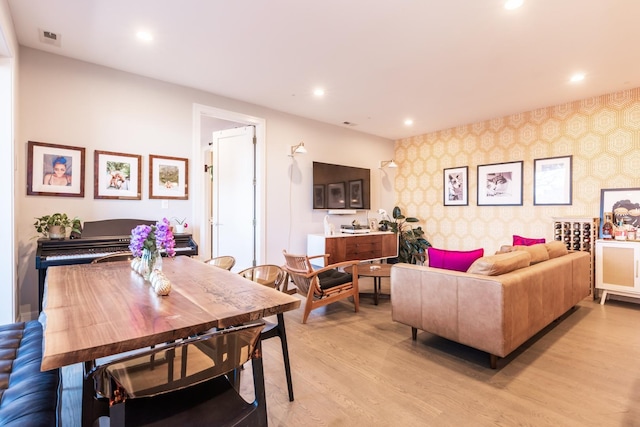 living room featuring recessed lighting, visible vents, light wood-style flooring, and wallpapered walls