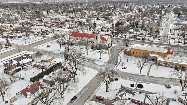 snowy aerial view with a residential view