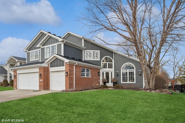 view of front of home with board and batten siding, brick siding, driveway, and a front lawn