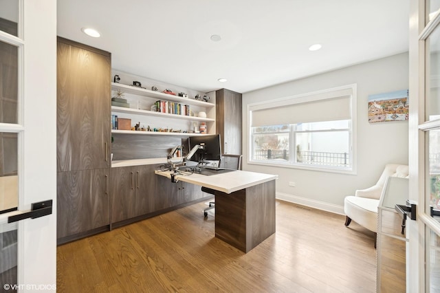 office featuring recessed lighting, baseboards, and wood finished floors