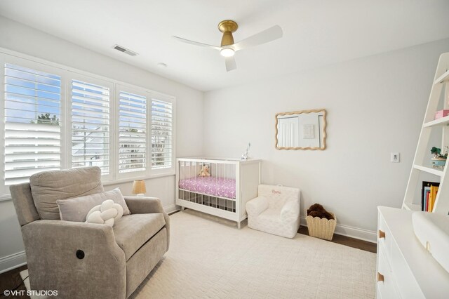 bedroom featuring a ceiling fan, visible vents, and baseboards